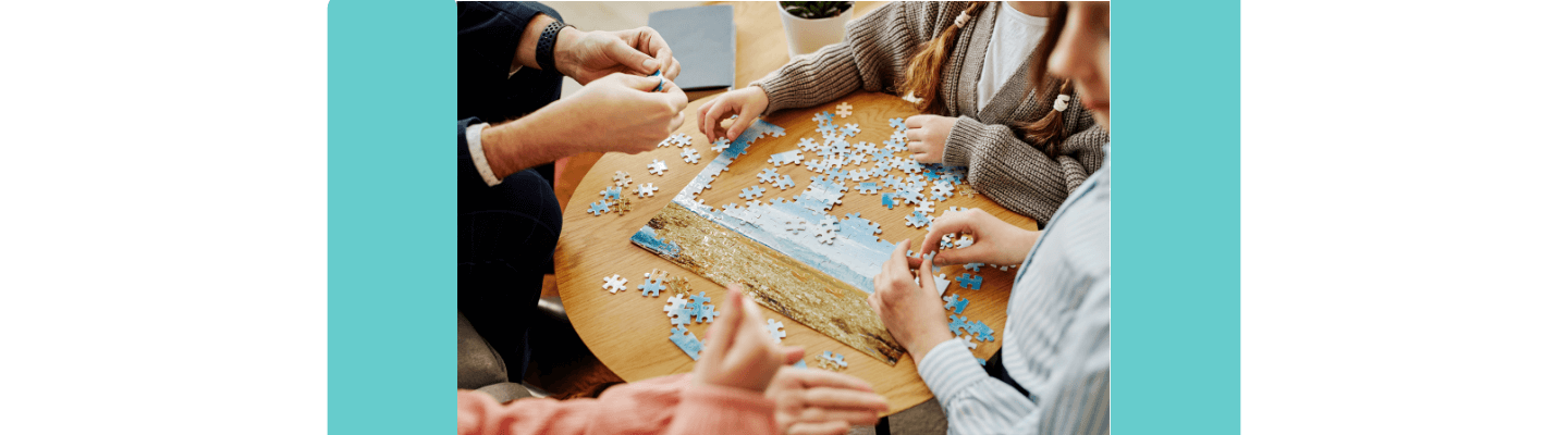 Adults putting a puzzle together